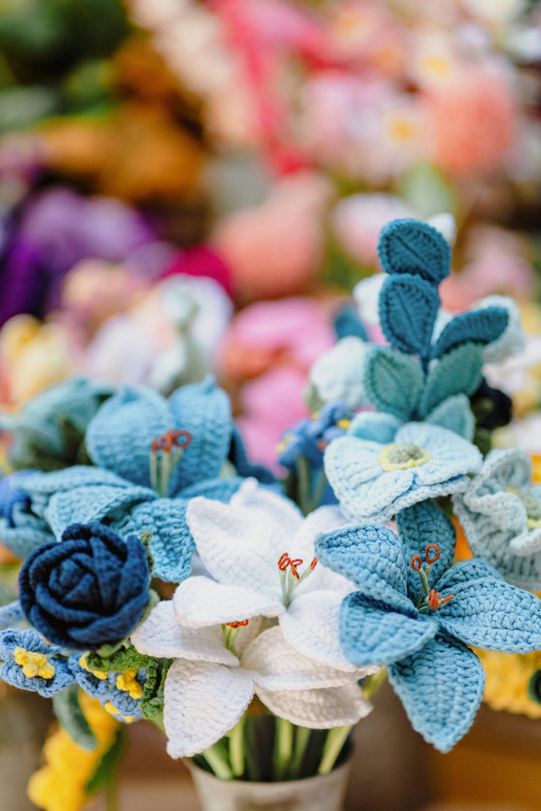 Handmade crochet flower bouquet with pink and red roses wrapped in ribbon — a perfect forever gift for any occasion